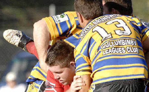 Solid tackle: Byron Bay prop Chris Coleman gets the treatment from the Mullumbimby defence yesterday. Solid tackle: Byron Bay prop Chris Coleman gets the treatment from the Mullumbimby defence yesterday.
